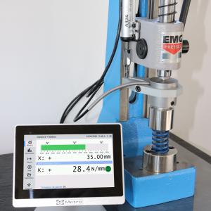 Spring force being checked at a specified length with a force transducer and a METRO display