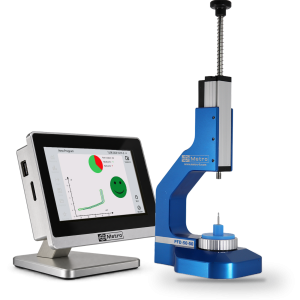 Press fitted with a force sensor and a METRO display showing the force-displacement curve